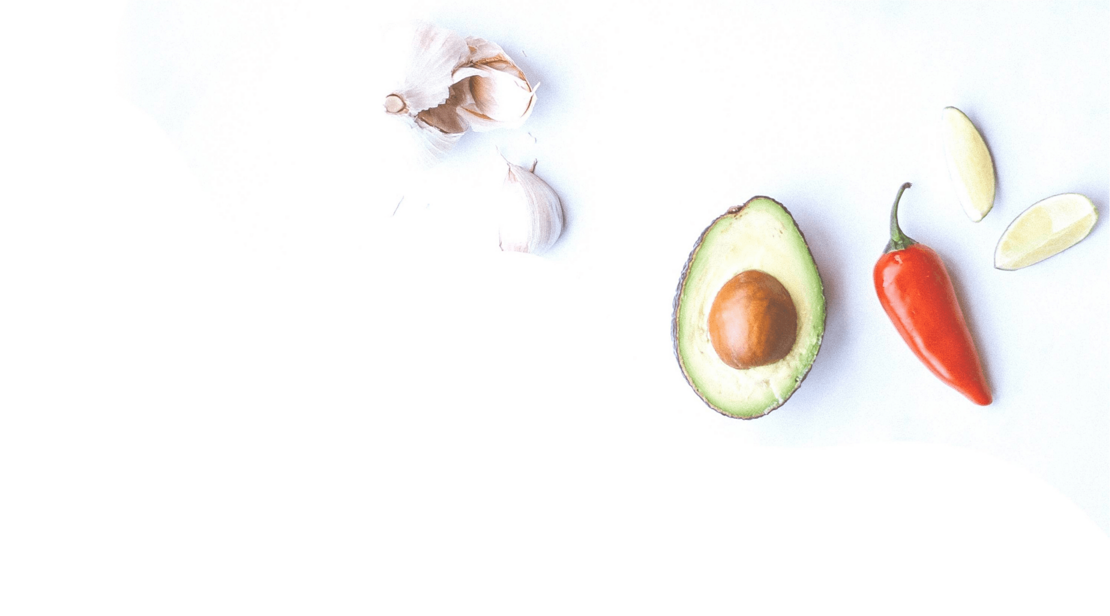 Avocado, garlic and pepper on white background
