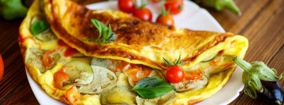 Keto omelet with eggplant and tomatoes.