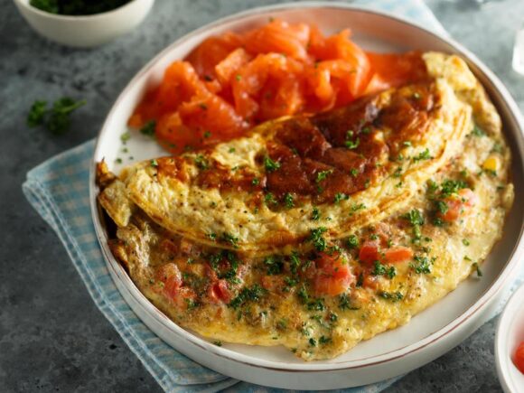 Keto omelet with salmon and tomatoes.